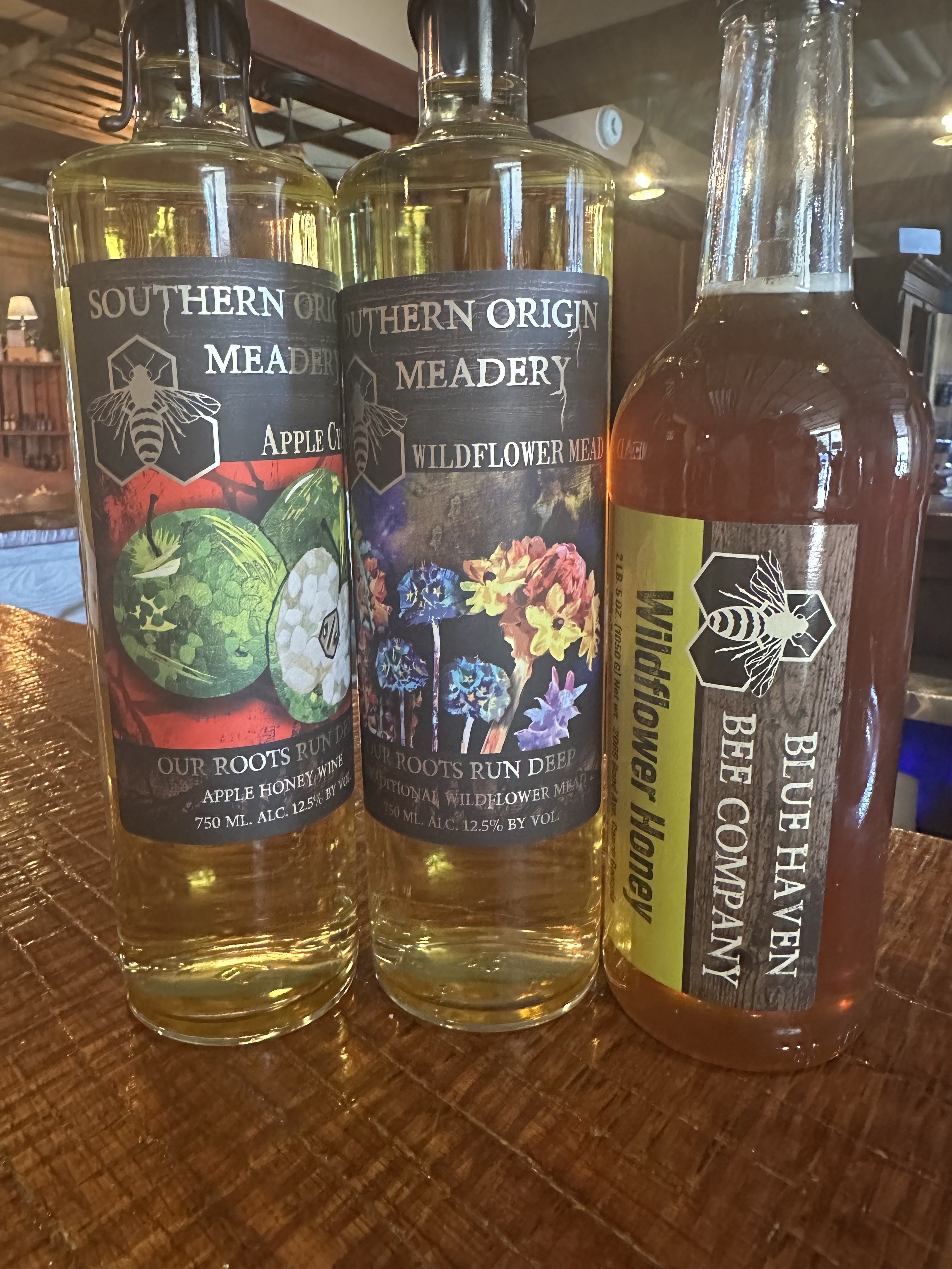 Two bottles of mead and a jar of honey purchased